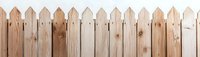 Rustic wooden picket fence panorama showing natural wood grain texture and pattern. Light brown unpainted boards create classic farmhouse style barrier.