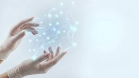 Hands holding glowing digital network connections with light blue particles and data visualization effects on white background for technology concepts.