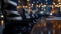 Empty black leather office chairs in dark conference room with bokeh lights and reflective wooden table, creating atmospheric business environment.