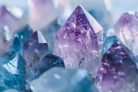 Collection of purple and blue healing crystals with natural formations and translucent surfaces for spiritual wellness and meditation practices.
