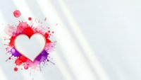 White heart shape surrounded by vibrant red and purple paint splashes on clean background for romantic designs and Valentine's Day projects.