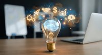Light bulb with glowing brain and business icons floating above wooden desk with laptop in modern office environment for innovation concepts.
