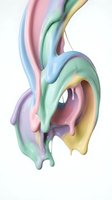 Abstract liquid paint splash in pastel rainbow colors flowing downward on white background. Smooth glossy dripping effect for creative design projects.