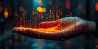 Glowing orange digital particles float above outstretched palm against dark background with bokeh lights, representing technology and innovation concept.