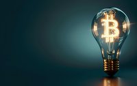 Glowing bitcoin symbol inside light bulb on dark teal background with copy space, representing cryptocurrency innovation and digital finance solutions.