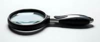 Handheld magnifying glass with black frame and handle featuring clear lens for reading, inspection, and detailed examination tasks.