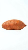 Fresh sweet potato isolated on white background, ready for culinary, nutritional, and food photography projects.