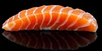 Fresh salmon sashimi slices arranged in row on black background with reflection. Raw fish for Japanese cuisine, sushi restaurant menu, seafood dining.