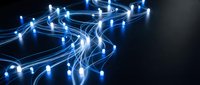 Glowing blue fiber optic cables creating flowing light trails with bright connection points on dark background for technology and network concepts.