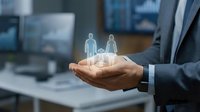 Businessman holding holographic family figures in cupped hands representing life insurance protection and financial security planning in modern office.