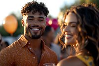 Young diverse couple sharing joyful moment at outdoor summer festival with warm sunset lighting and bokeh background. Perfect for lifestyle and relationship content.