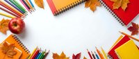 Back to school autumn flat lay with colorful pencils, notebooks, apple and fall leaves creating frame on white background for educational design.