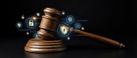 Wooden gavel with digital security icons including locks and shields floating around it on dark background, representing cybersecurity law and legal protection.