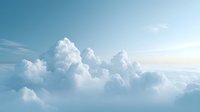 Dramatic white cumulus clouds formation against light blue sky background with soft sunlight creating ethereal atmospheric scene. Suitable for nature and weather designs.