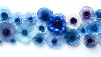 Delicate watercolor anemone flowers in shades of blue and purple create an ethereal border arrangement on white background, suitable for wedding stationery.