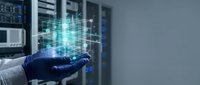Technician in blue gloves holding digital holographic data cube in server room, representing cloud computing, network infrastructure, and data management technology solutions.