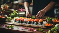 Fresh salmon nigiri and maki sushi rolls arranged on wooden board with garnish, sauces and ingredients. Dark moody food photography with selective focus.