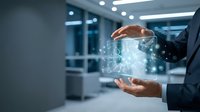 Businessman holding transparent digital cube with glowing data network particles, representing cloud computing, data storage, and technology innovation in modern office environment.