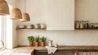 Modern minimalist kitchen interior with natural wicker pendant lights, wooden shelving, potted herbs, and neutral beige tones for home design projects.