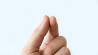 Isolated hand gesture showing two fingers raised in peace sign or victory symbol against white background, suitable for design projects and digital applications.
