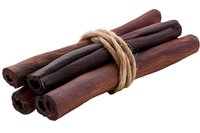 Aromatic cinnamon sticks bundle tied with natural jute rope on white background, isolated spice ingredient for cooking, baking and holiday decorations.