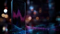 Smartphone displaying vibrant audio wave visualization with flowing particle effects and bokeh lights in dark background, modern technology concept for music and sound analysis.