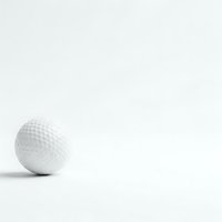 White golf ball with dimpled surface on clean white background with copy space for sports and recreation marketing materials.