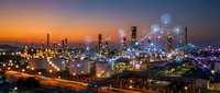 Smart industrial complex with digital network connections at sunset showcasing modern manufacturing technology and IoT connectivity for business automation.