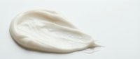 White cosmetic cream smear with smooth texture on clean background for skincare and beauty product advertising applications.