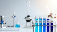 Laboratory test tubes with colorful chemical solutions in modern research facility for scientific experiments and analysis.
