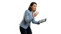 Professional businesswoman in blue blazer holding tablet making shush gesture on white background isolated for business communication designs.