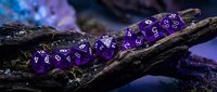 Purple polyhedral dice set arranged on weathered wood branch with mystical blue lighting, perfect for tabletop gaming, fantasy campaigns, and role-playing game content.