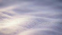 Macro shot of frost crystals on a frozen surface with soft bokeh background, suitable for winter themes and nature backgrounds.