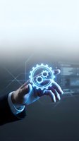 Businessman hand holding glowing gear icon with digital interface, representing technology, innovation, and industrial automation for business solutions.
