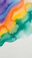 Vibrant watercolor paint flowing in rainbow gradient from purple to orange yellow and green on white paper texture for creative artistic projects.