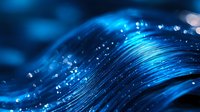 Abstract blue wave with sparkling water droplets and flowing liquid motion creating dynamic energy for modern digital backgrounds and technology concepts.