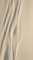 Flowing cream and beige fabric with soft shadows and elegant drapes, suitable for backgrounds, textile design, and luxury branding projects.