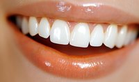 Close up of healthy white teeth and natural pink lips showing bright smile. Professional dental care and oral hygiene concept for healthcare industry.