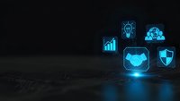 Futuristic holographic business icons floating above dark surface with blue neon glow for technology presentations and digital transformation concepts.