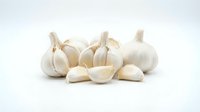 Whole and sliced garlic cloves isolated on white background, ready for culinary, cooking, and food design projects.