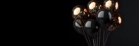 Elegant black and metallic copper balloons floating against dark background, creating luxurious festive atmosphere. Modern party decoration concept.