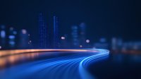 Futuristic glowing light trails curve through dark cityscape with illuminated skyscrapers and bokeh effects creating modern urban nighttime atmosphere.