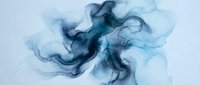 Abstract blue ink flowing in water creating organic fluid shapes and swirls for artistic backgrounds and creative design projects.