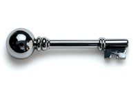 Vintage style silver metallic key with decorative round head and classic design isolated on white background, suitable for security and access concepts.