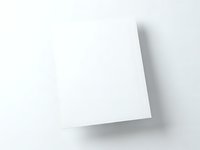 Blank white paper sheet with curled corner and shadow on light gray background for mockup and presentation designs.