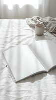 Cozy morning scene with open book, coffee cup and soft blanket on marble table by window. Peaceful reading moment in natural light for relaxation content.