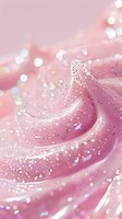 Swirling pink cream texture with sparkling glitter and bokeh effects creates dreamy, magical background for beauty and cosmetic product photography.