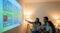 Family enjoying smart home entertainment system with interactive wall projection display showing media controls and weather information in modern living room.