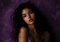 Young woman with long dark curly hair and glowing skin against purple background, dramatic lighting creates mysterious atmosphere for beauty and fashion photography.