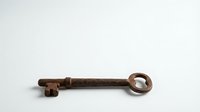 Antique rusty iron key isolated on white background, aged metal texture, vintage security concept for history and mystery designs.